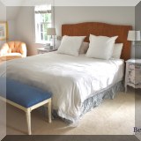 F55. King bed with braided rattan headboard. 57”h 